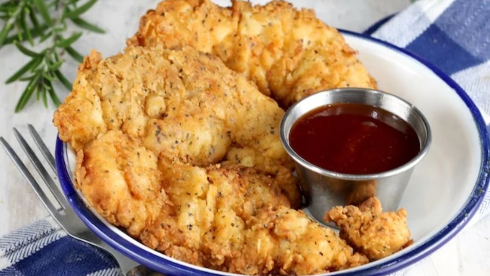 Chicken strips with dip on the side.