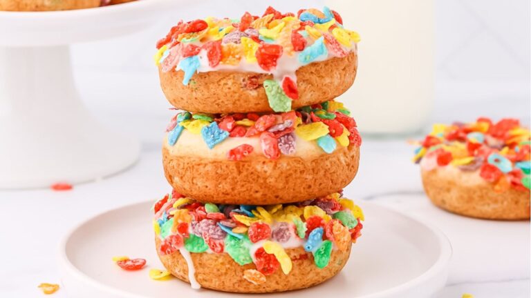 Stack of donuts with colorful pebbles.