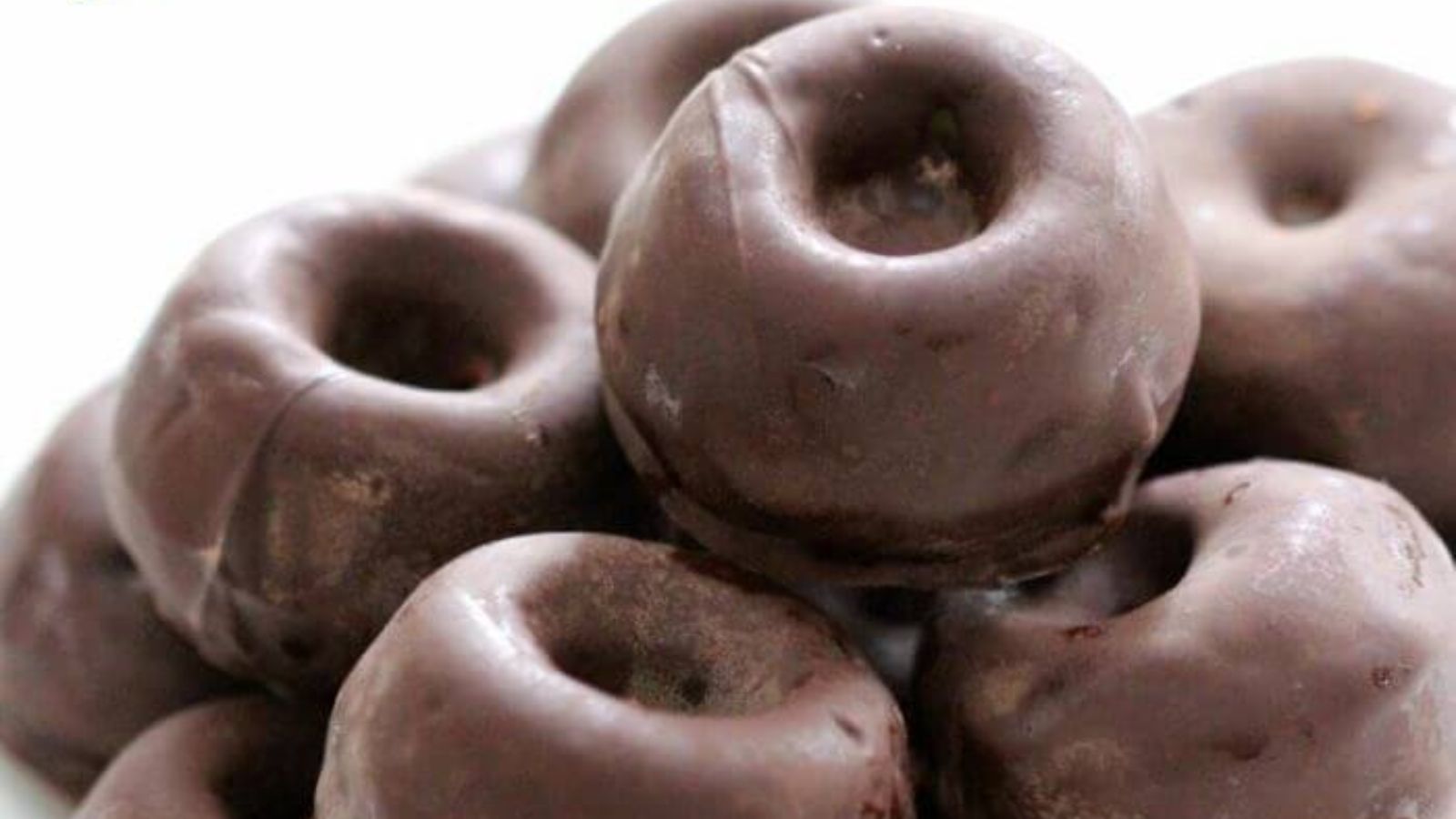 Close up of chocolate doughnuts.