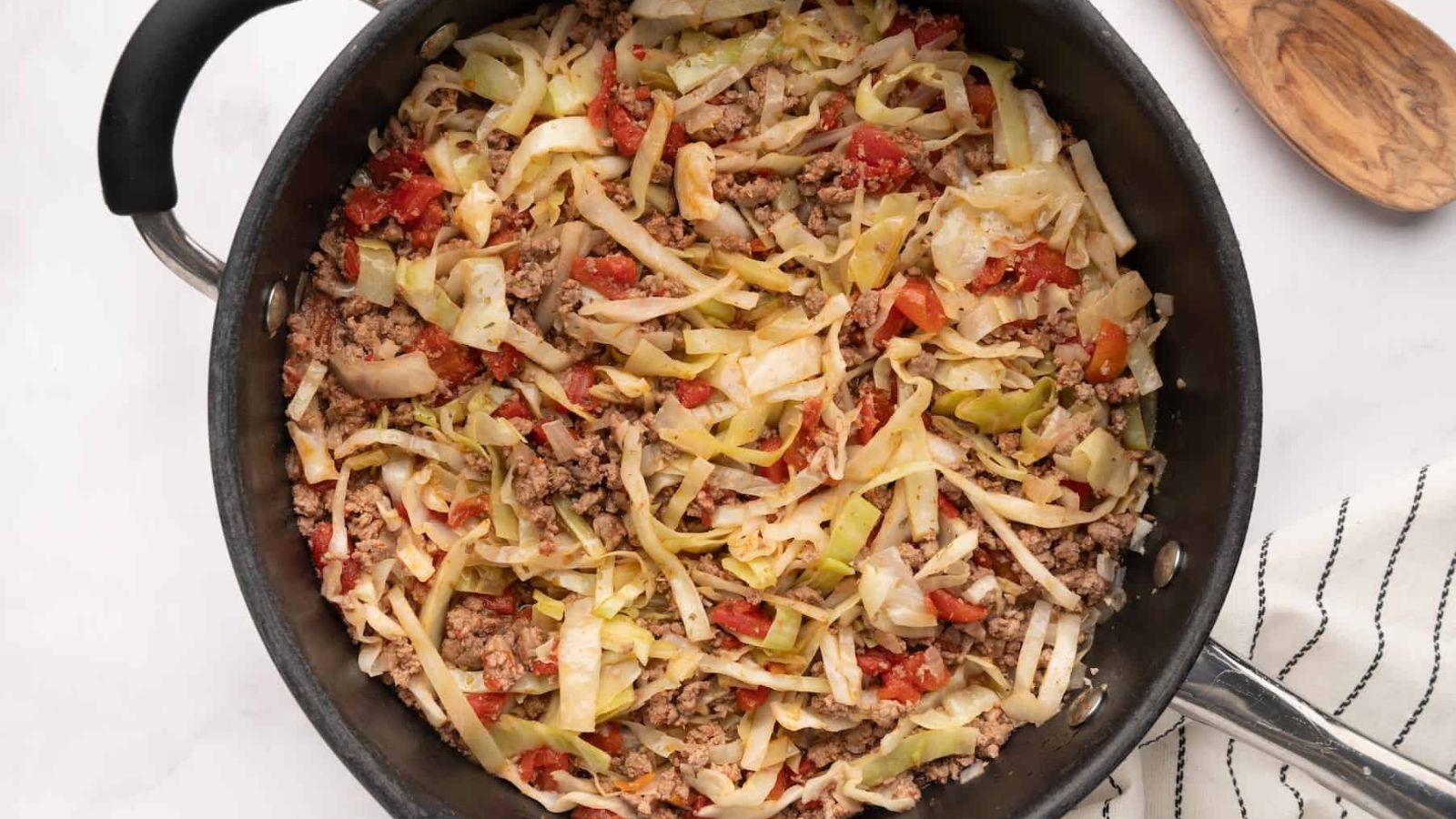 Ground beef with cabbage in a pan.