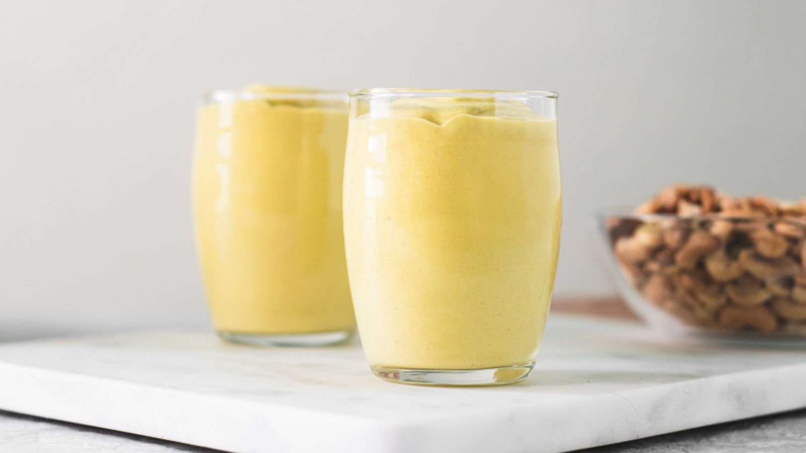 Two glasses of banana pudding with turmeric.