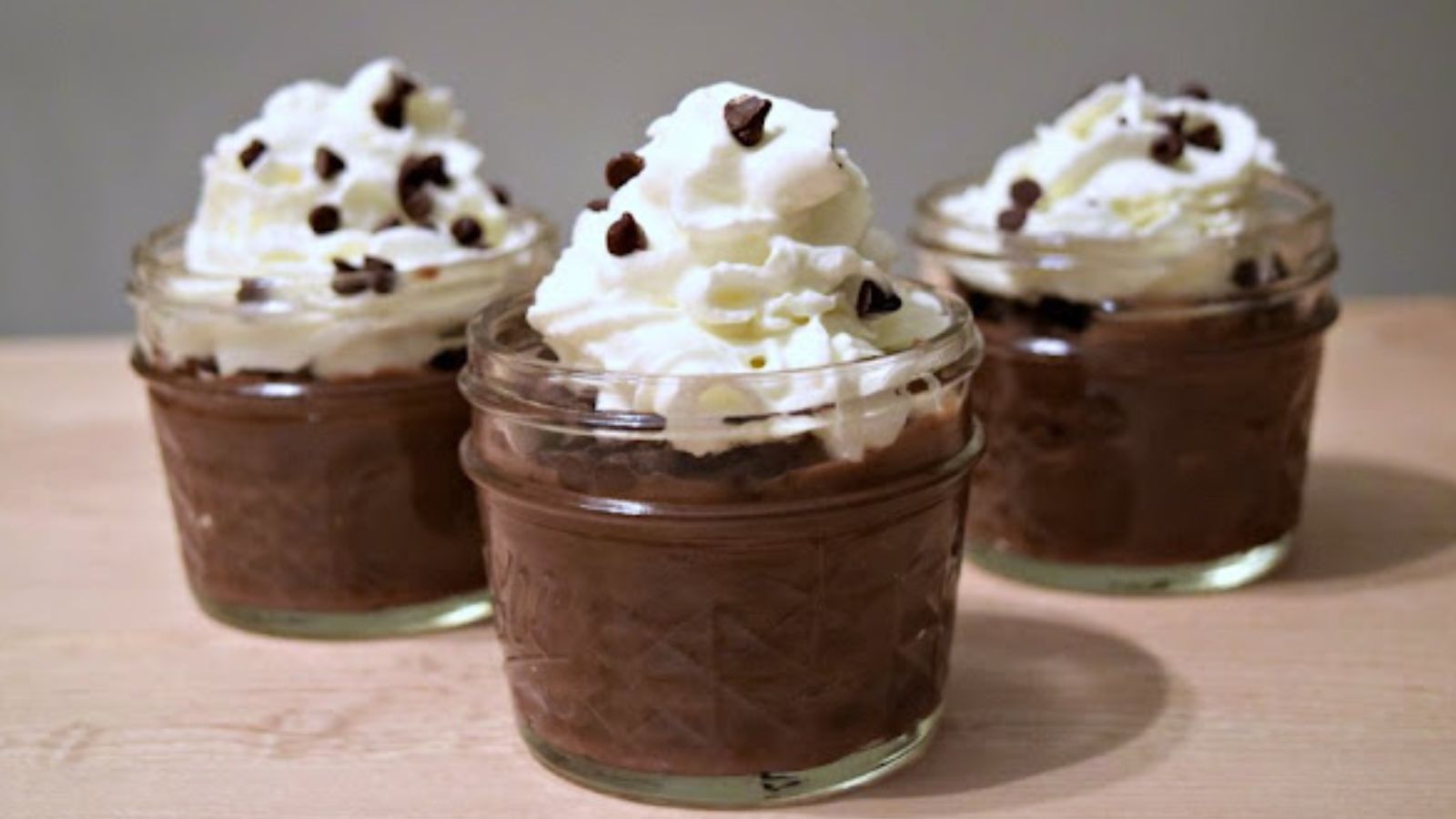 Three jars of chocolate puddings.