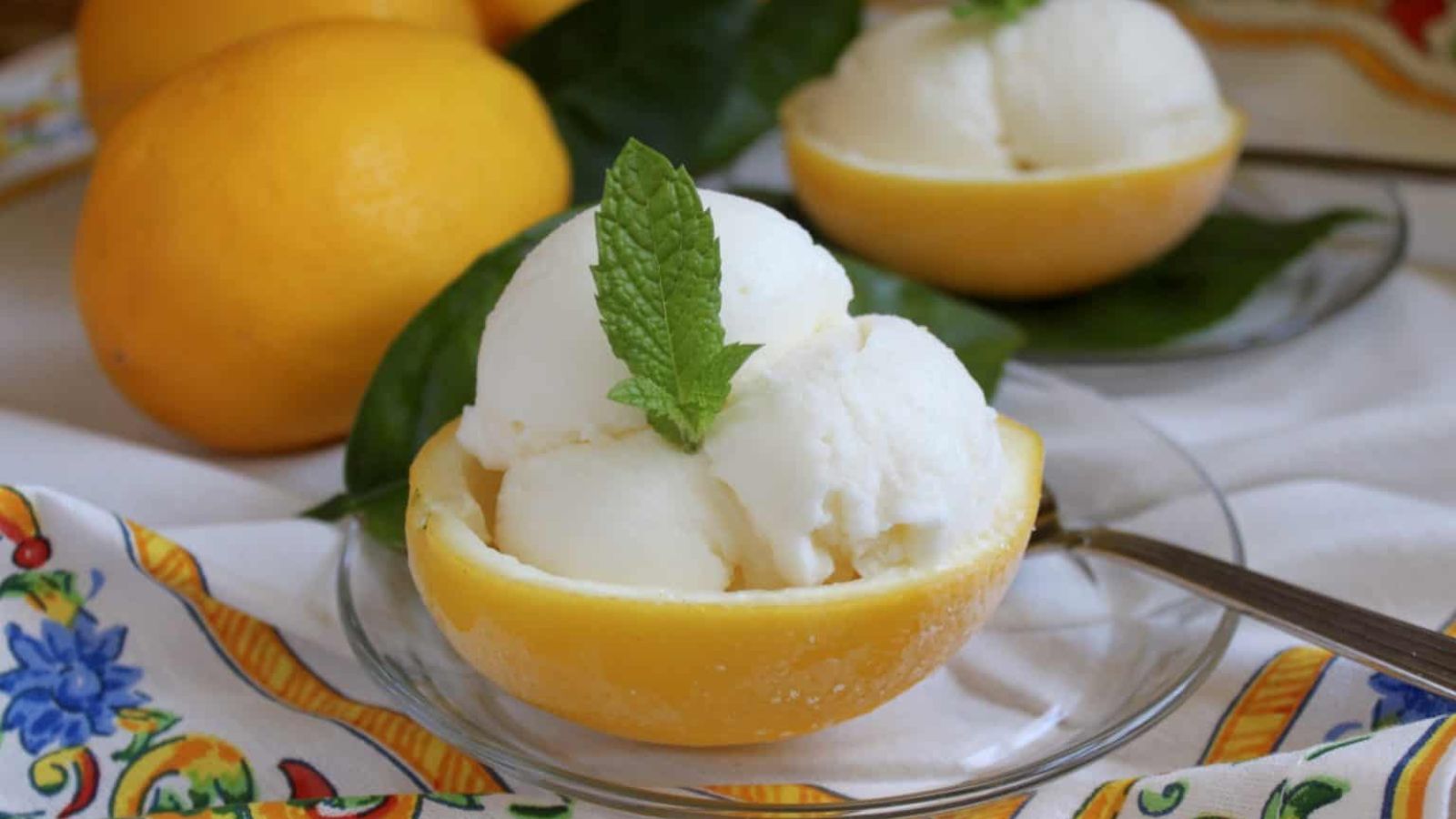 Scoops of lemon ice cream in a bowl.