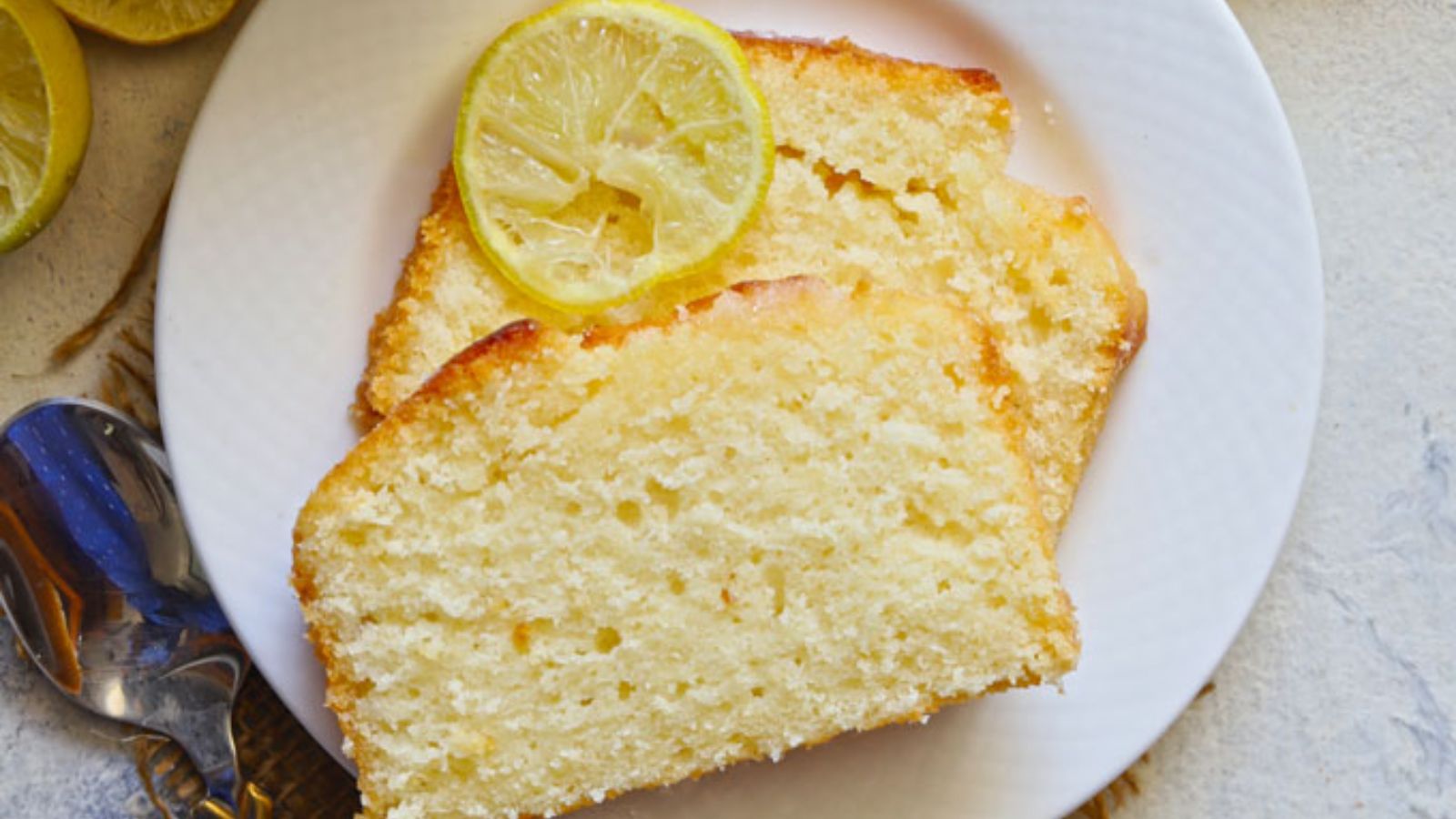 Slices of lemon pound cake on a plate.
