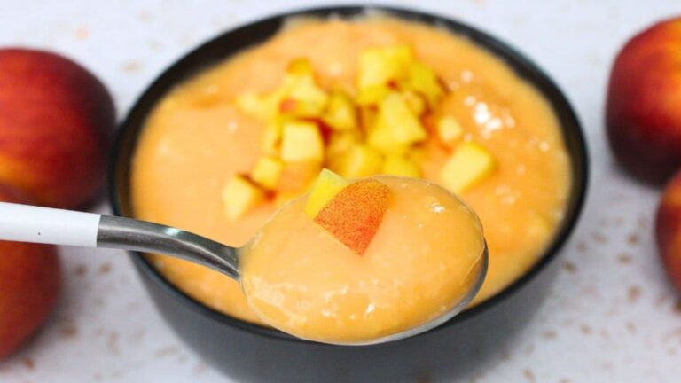 A spoonful of peach pudding.