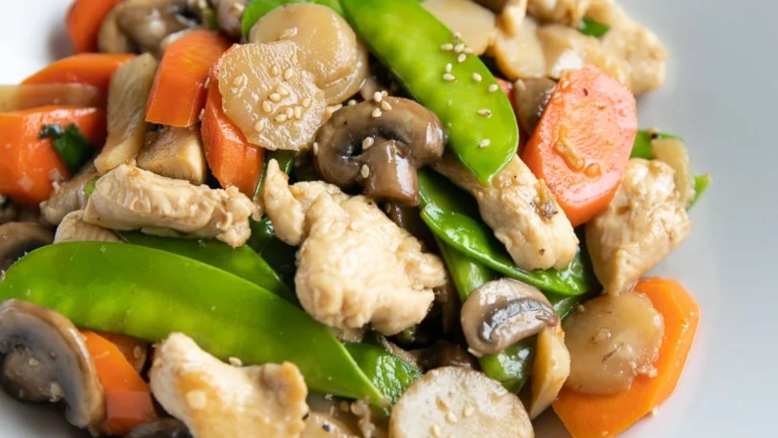 Chicken, mushroom and other vegetables close up shot.