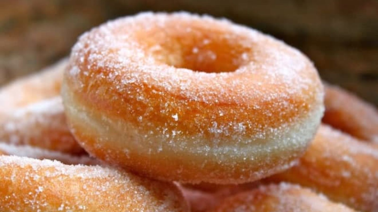Doughnuts coated with powdered sugar.
