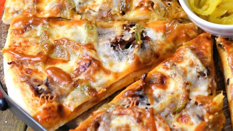 Slices of cheesesteak pizza.