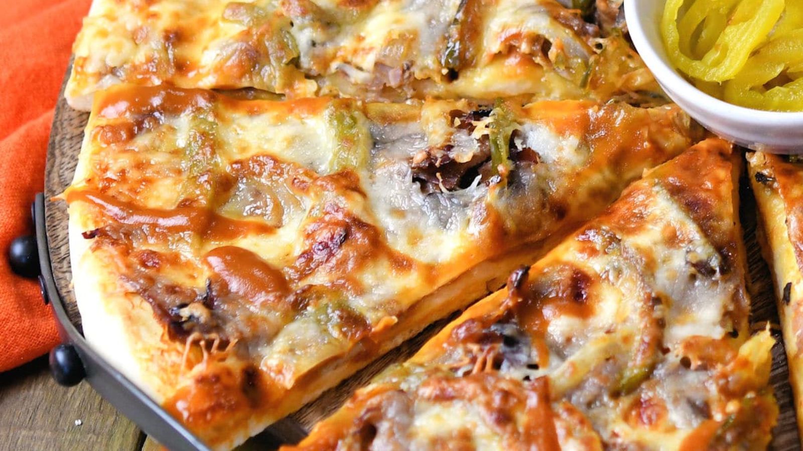 Slices of cheesesteak pizza.