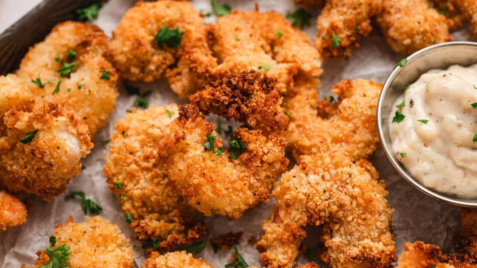 Fried shrimp with dip on the side.