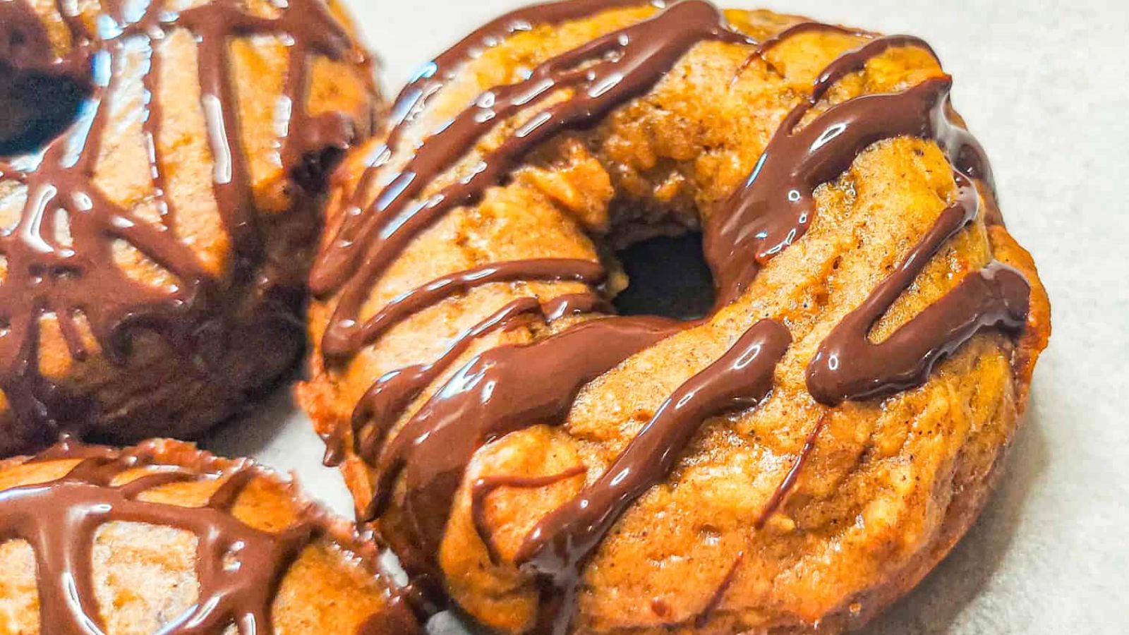 Donut with chocolate drizzle.
