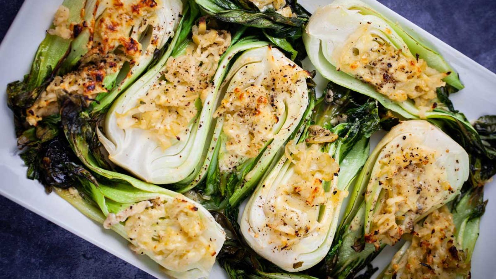 Roasted bok choy on a plate.