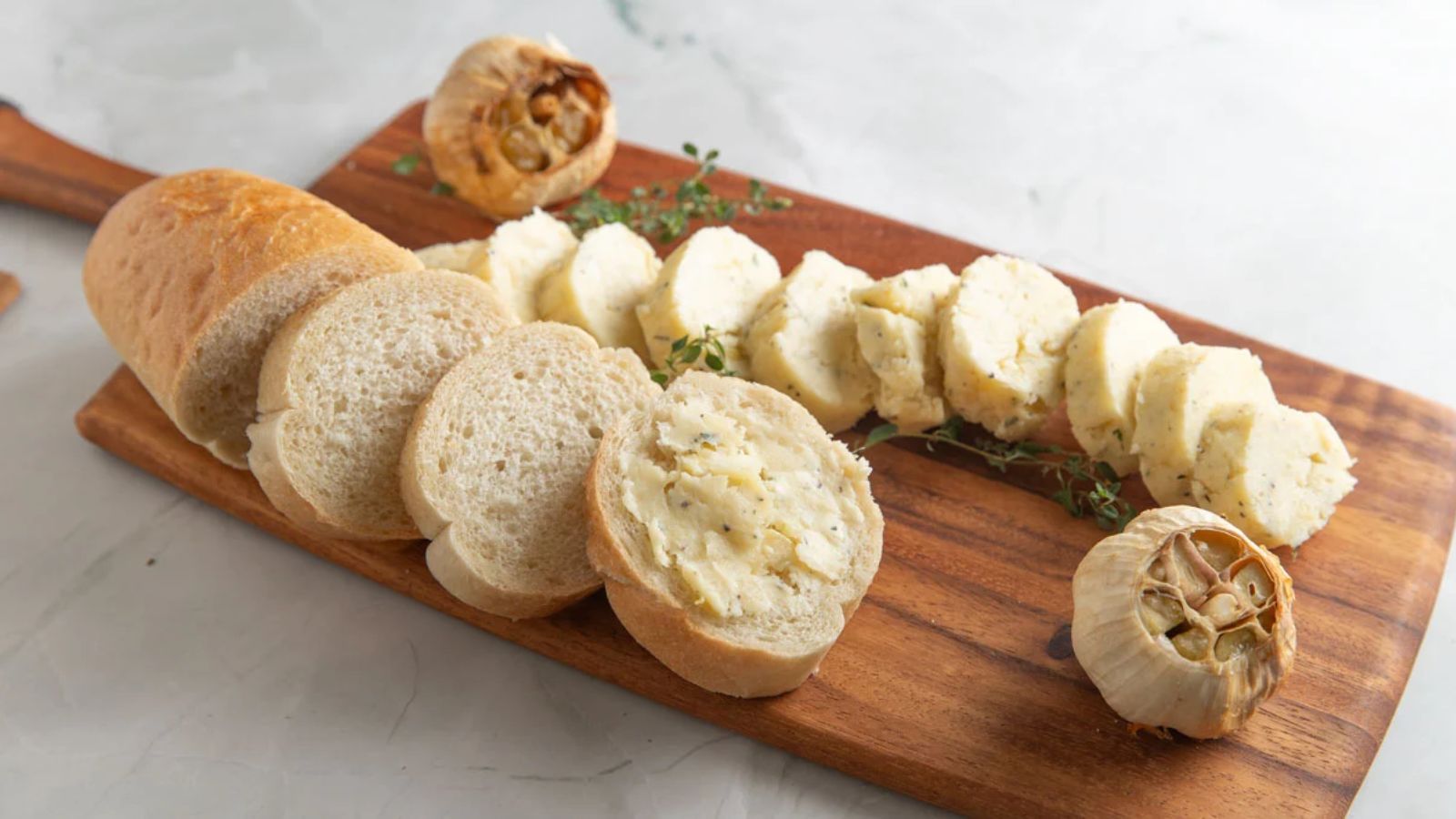 Sliced French bread slathered with roasted garlic butter.