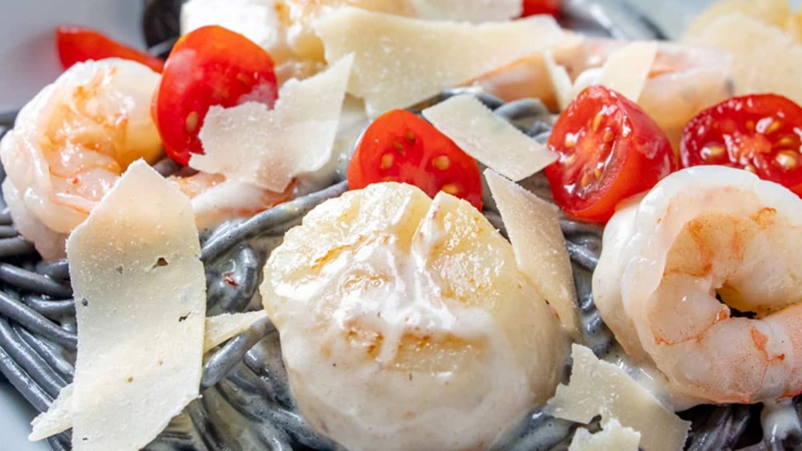 Shrimp scallop on a squid ink pasta.