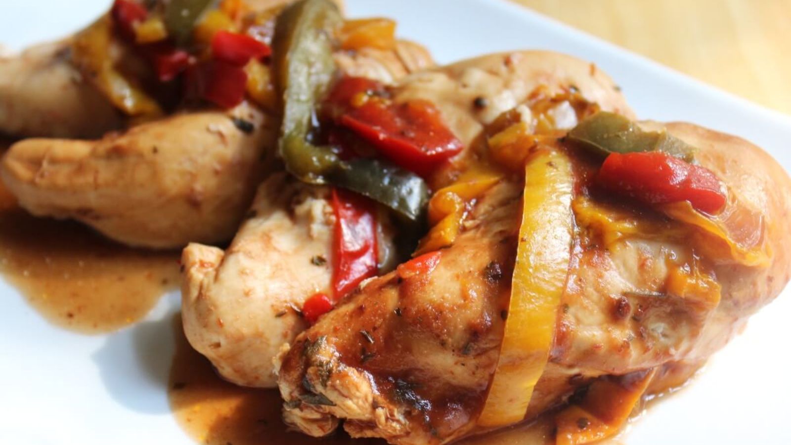 BBQ chicken with sauce on a plate. 