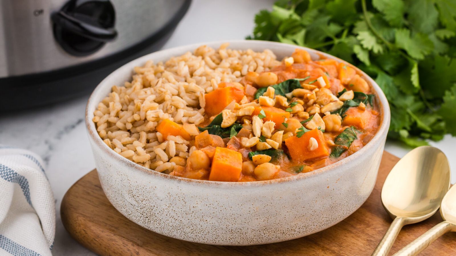 A bowl of peanut, sweet potatoes and chickpea stew.