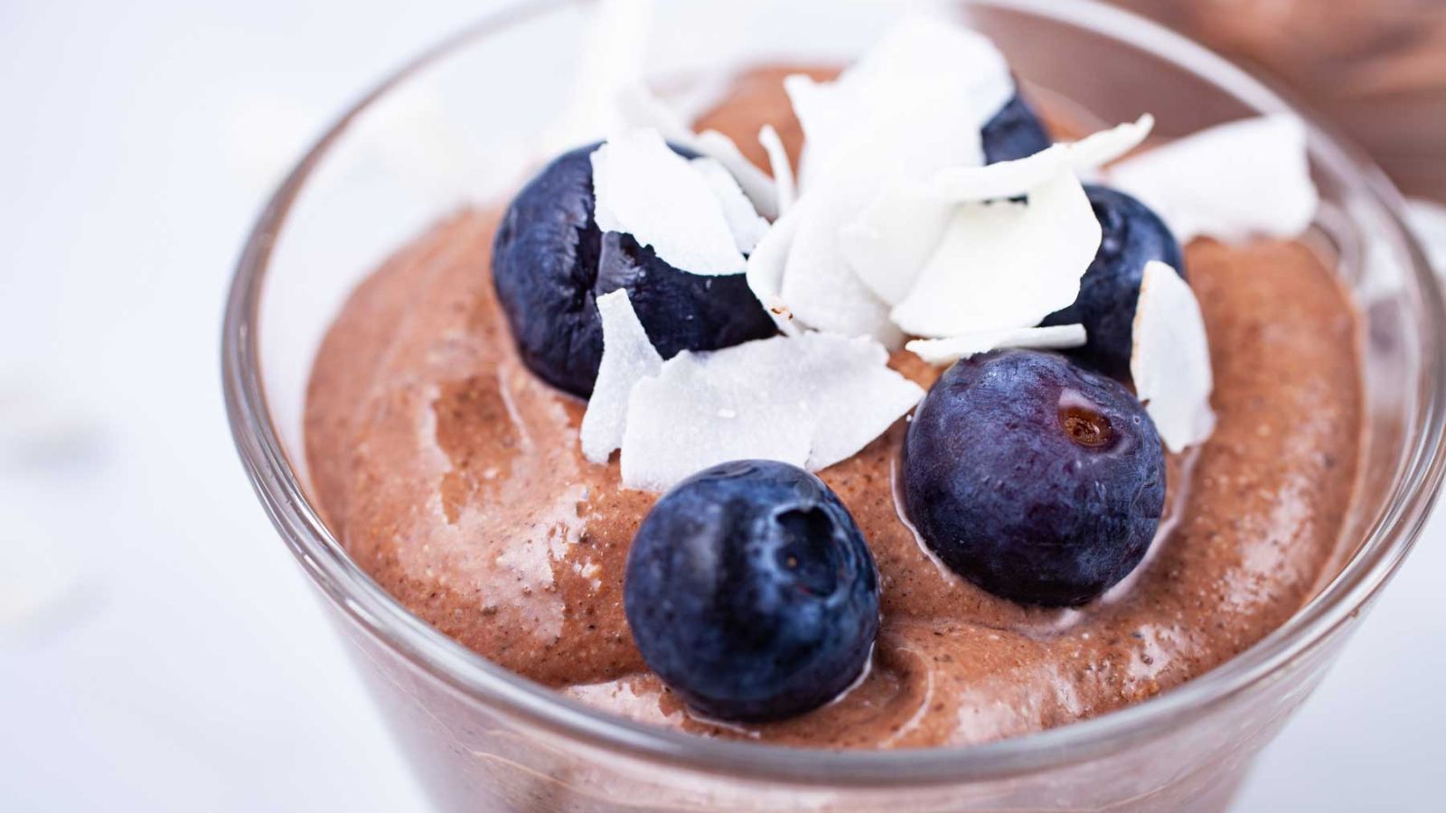 Chocolate mousse with blueberries on top.