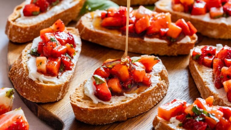 Strawberry bruschetta on a wooden board.