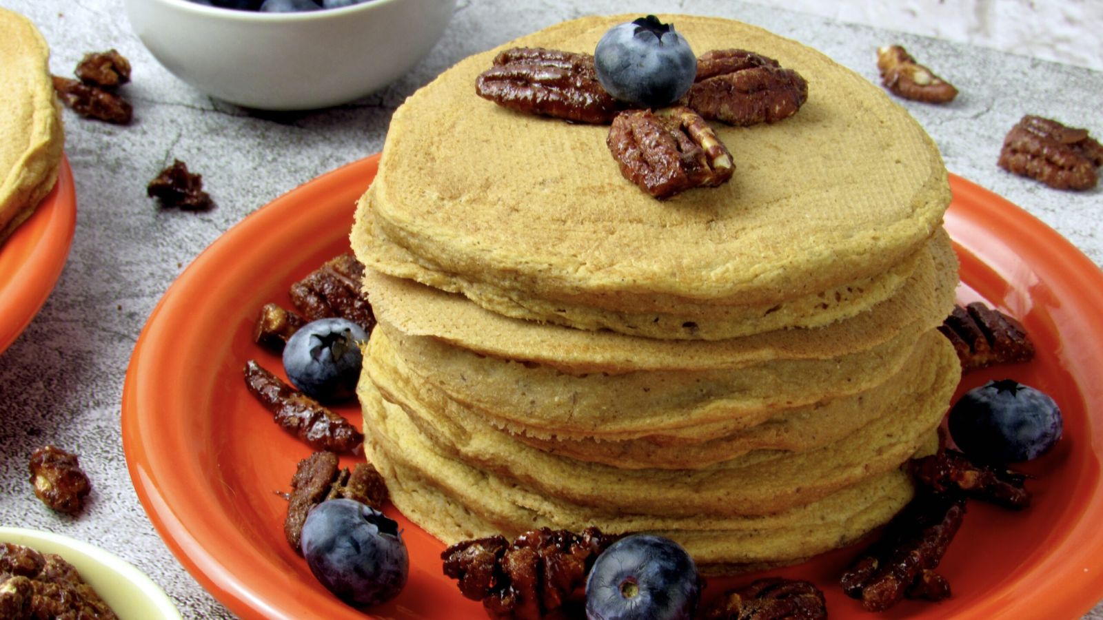 Stack of pancakes with blueberries.