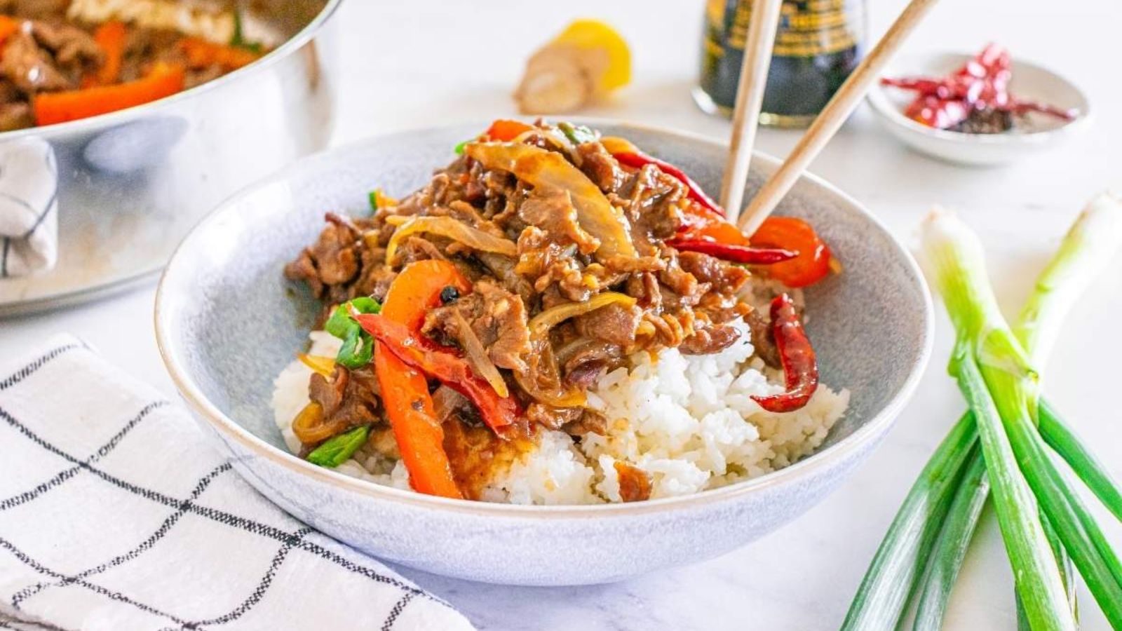 Rice with beef on top in a bowl.