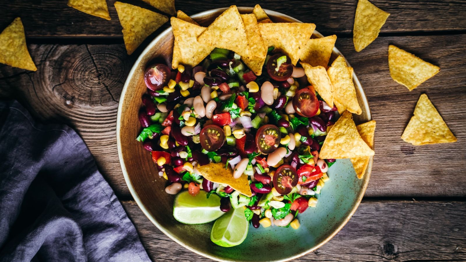 Salad with tortilla chips on the side.