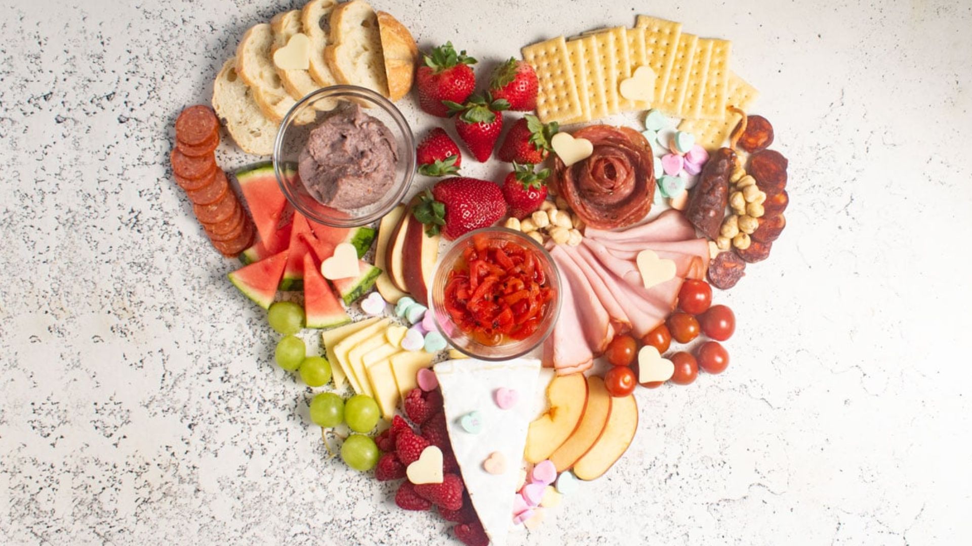 Valentines day charcuterie board in the shape of a heart.