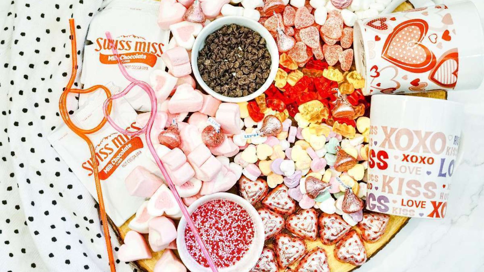 Mixed candies and hot chocolate charcuterie board.