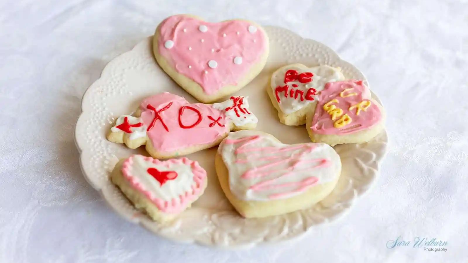 Heart shaped sugar cookies on a plate.