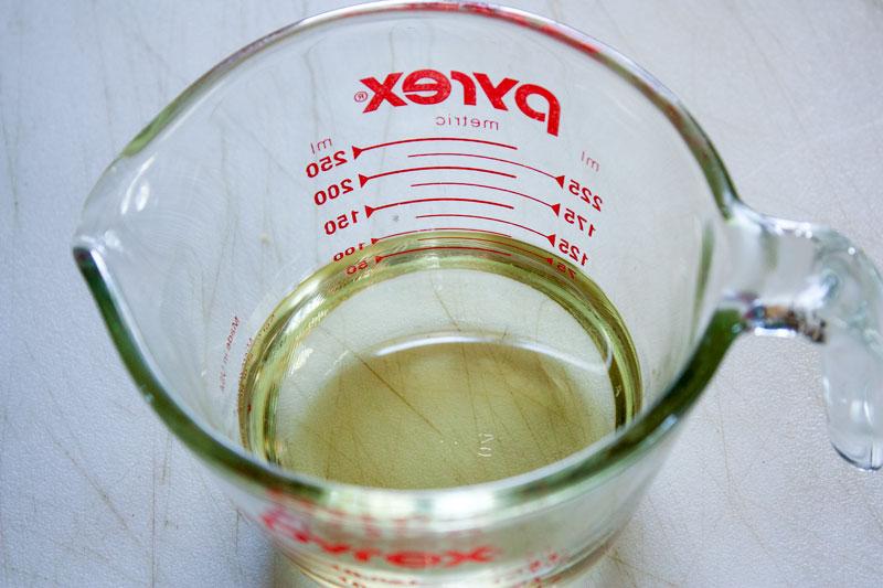 Measuring cup with oil.
