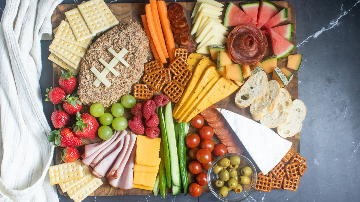 Colorful football charcuterie board on a black background.