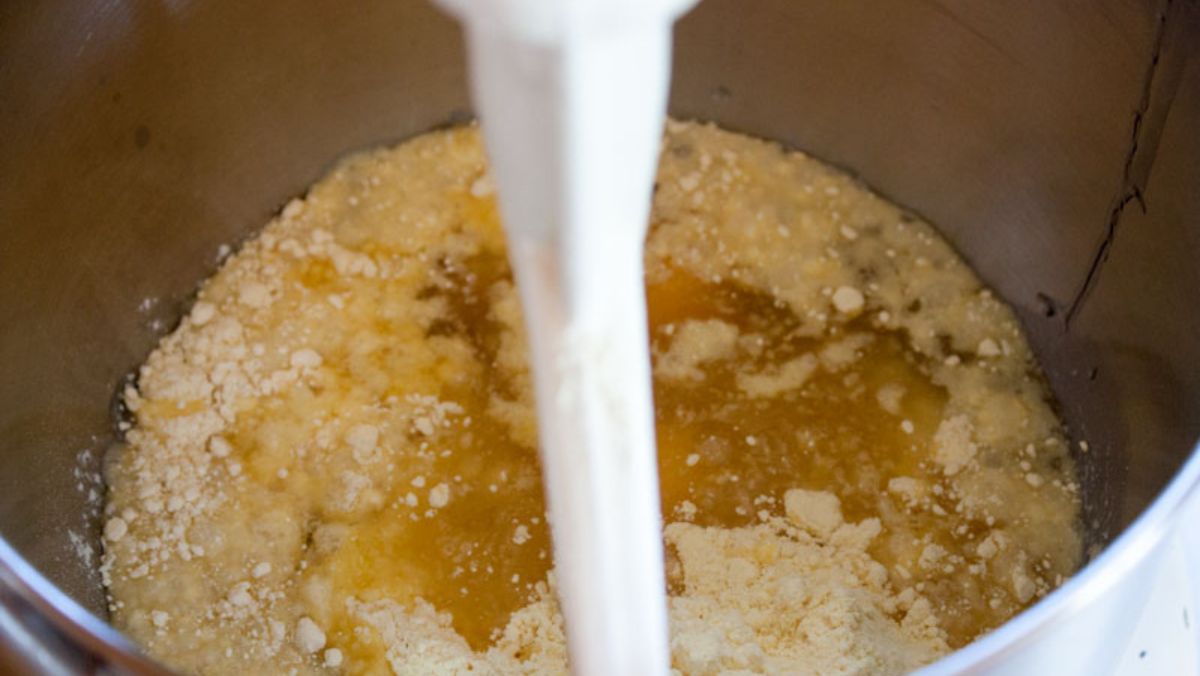 Ingredients for the cupcake mix into a bowl.