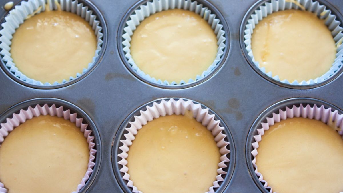 Cupcake liners filled with batter.