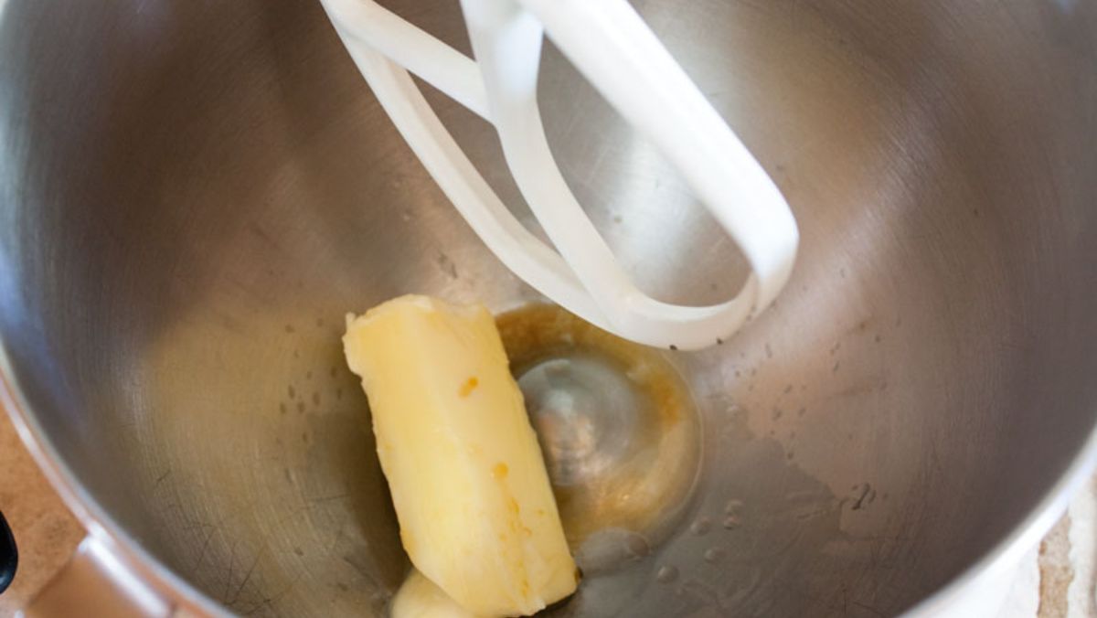 Butter and vanilla in a mixing bowl.