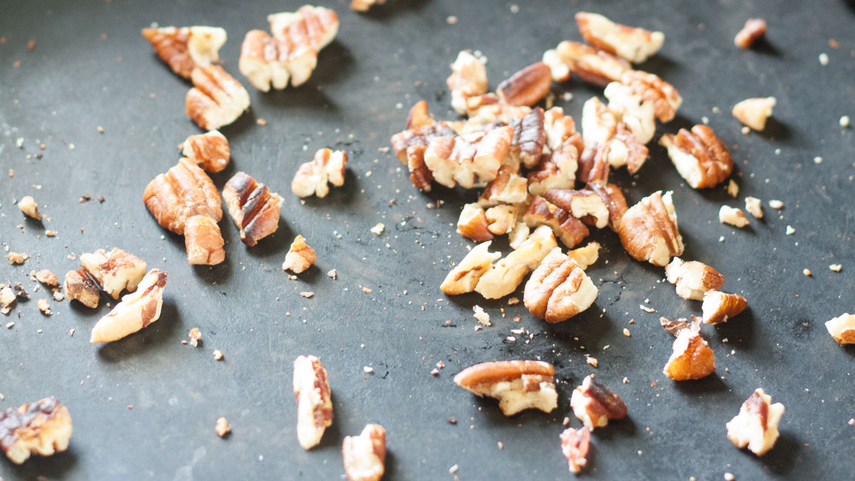 Toasting pecans in a dry frying pan.