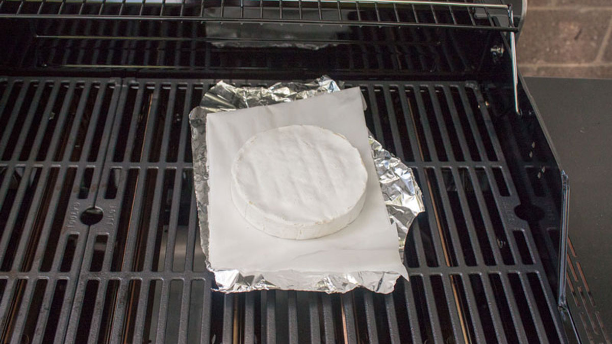 Brie wheel on the grill on foil.