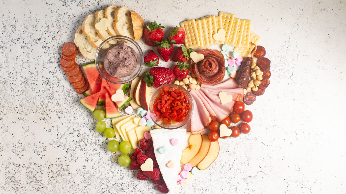 Heart-shaped charcuterie board for Valentine's day.