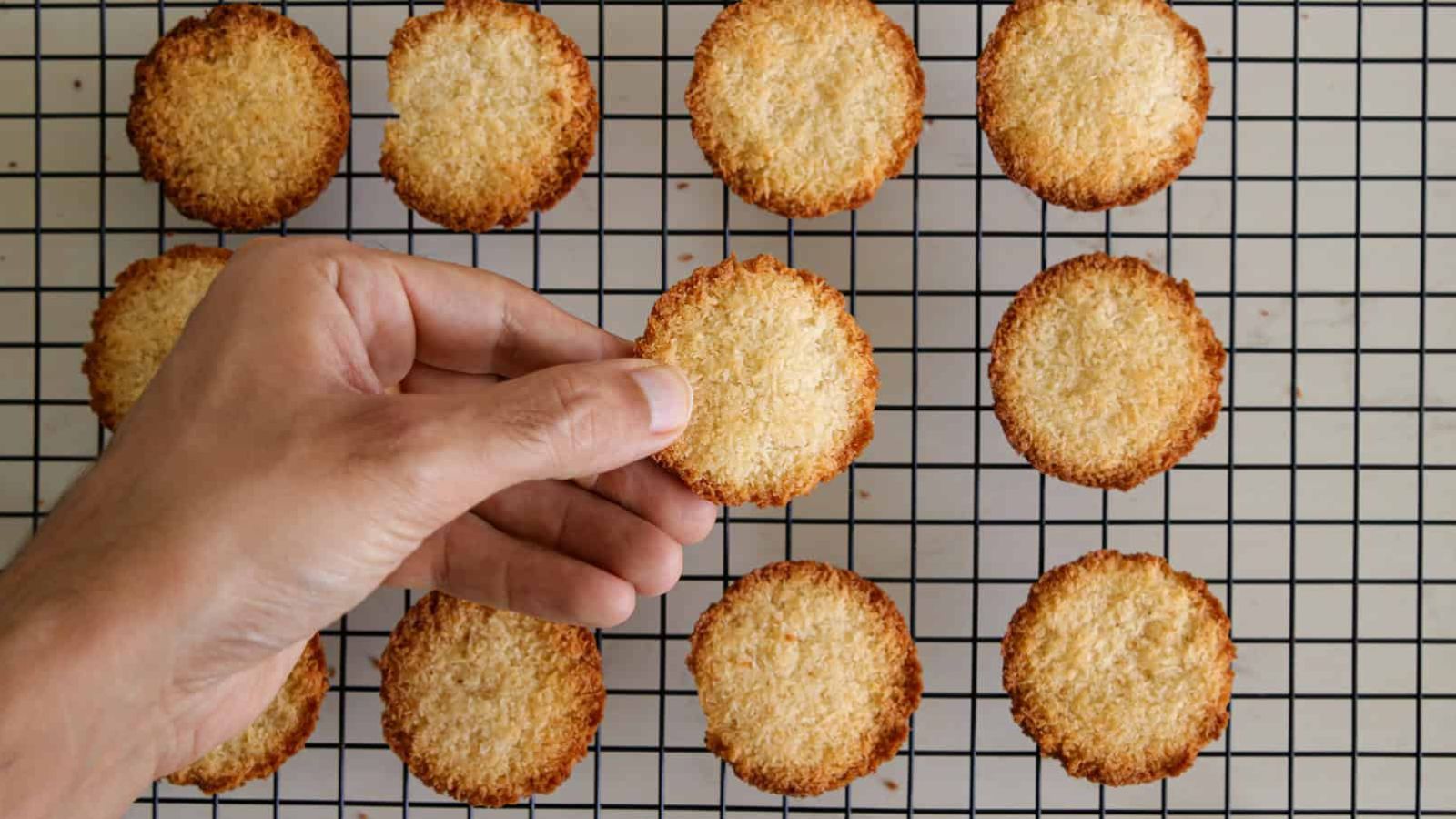 Coconut cookies on a drying rack.