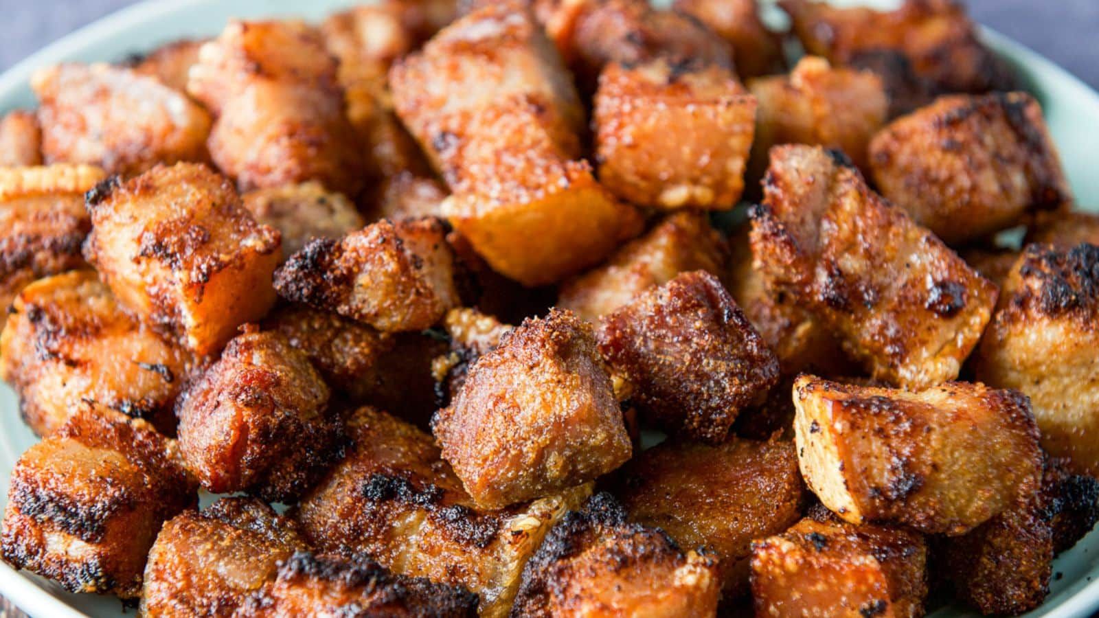 Pork belly bites close up.