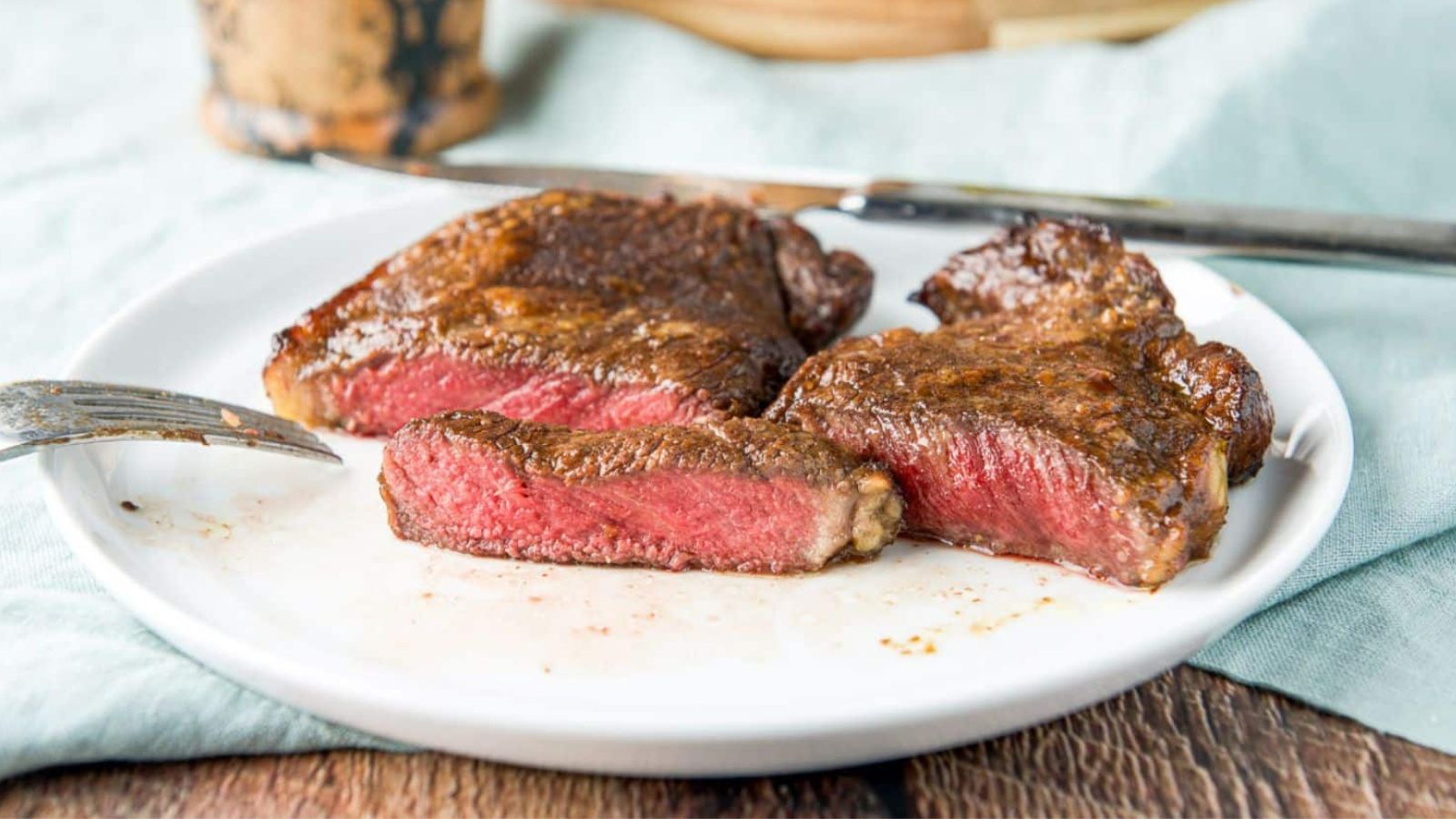 Sliced steak on a plate.