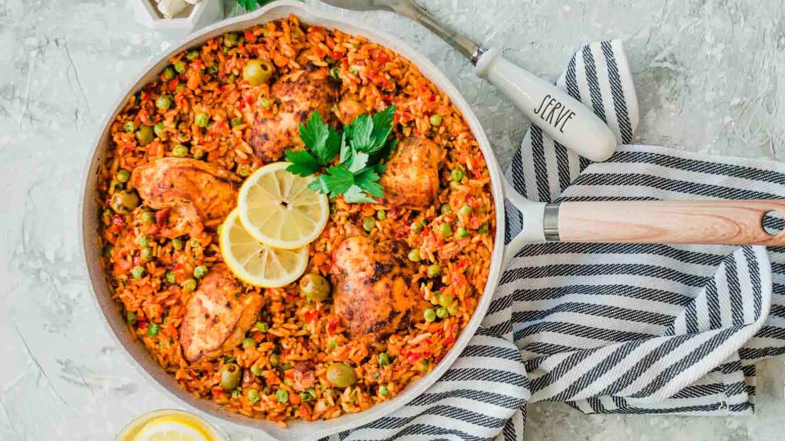 Chicken and yellow rice in a pan.
