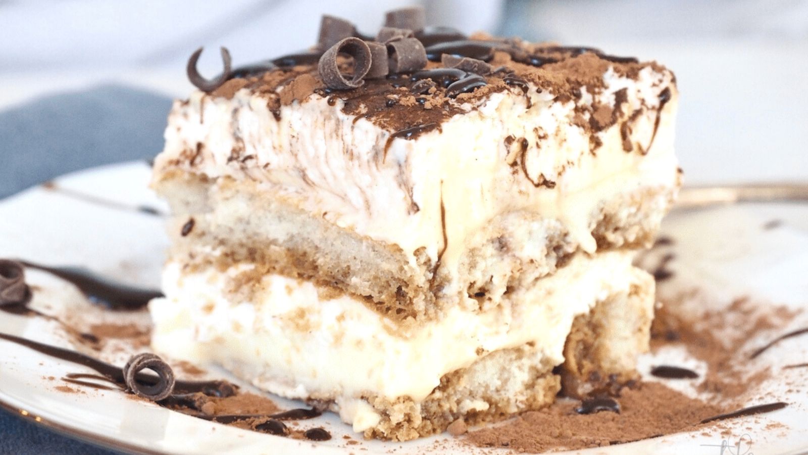 A slice of tiramisu cake on a plate.
