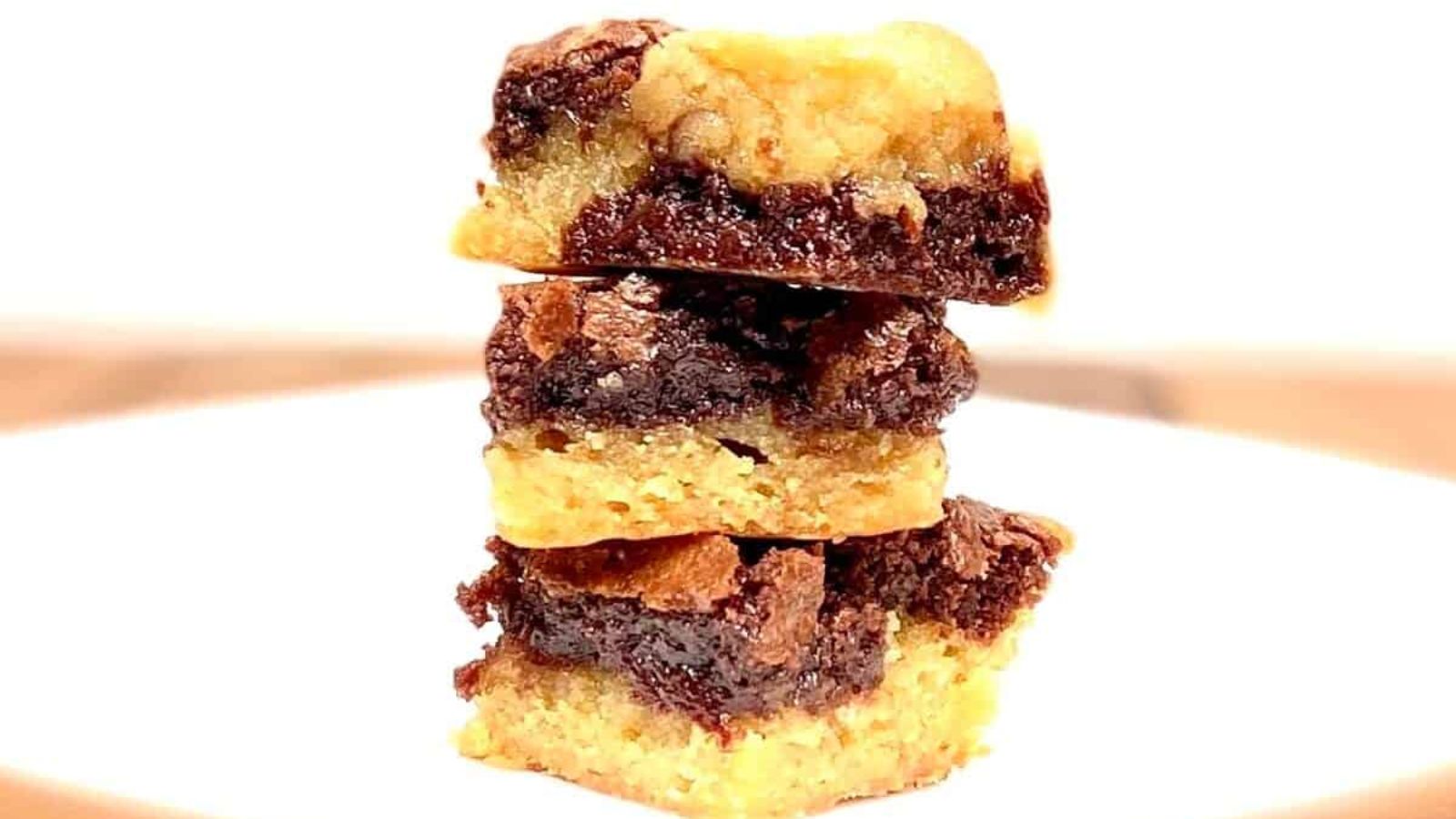 Stack of brownie blondies on a plate.