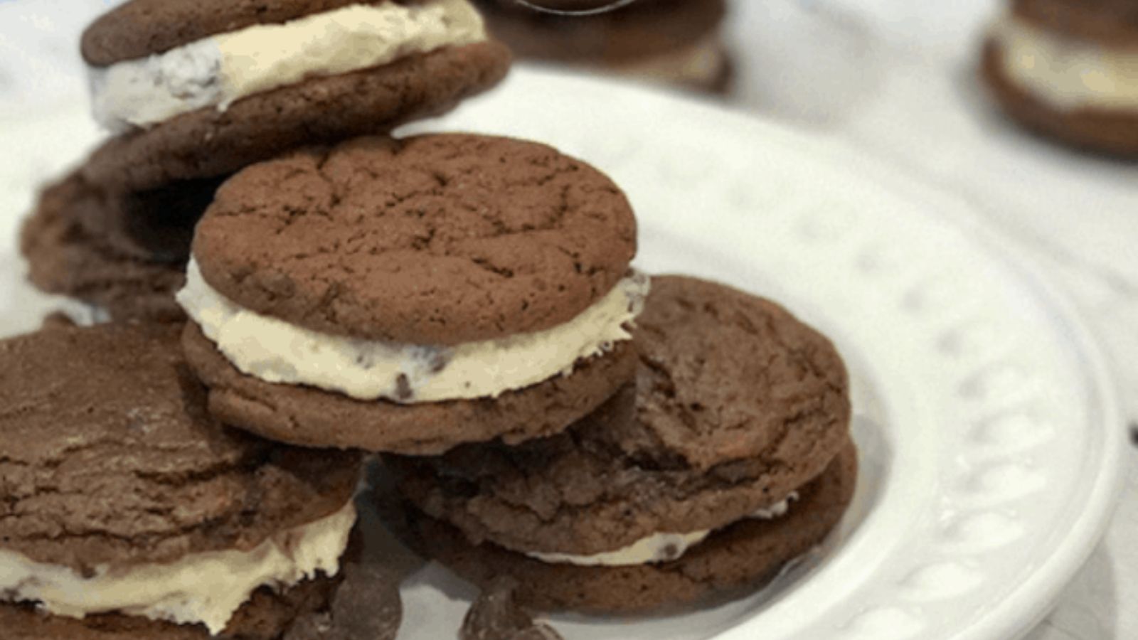 Brownie sandwich cookies on a plate.