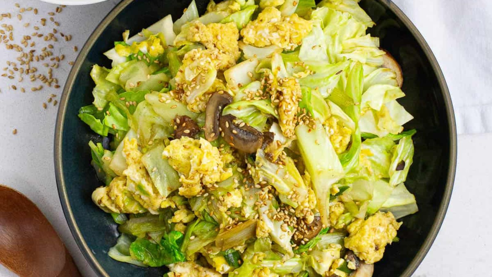 Cabbage and egg stir fry on a plate.