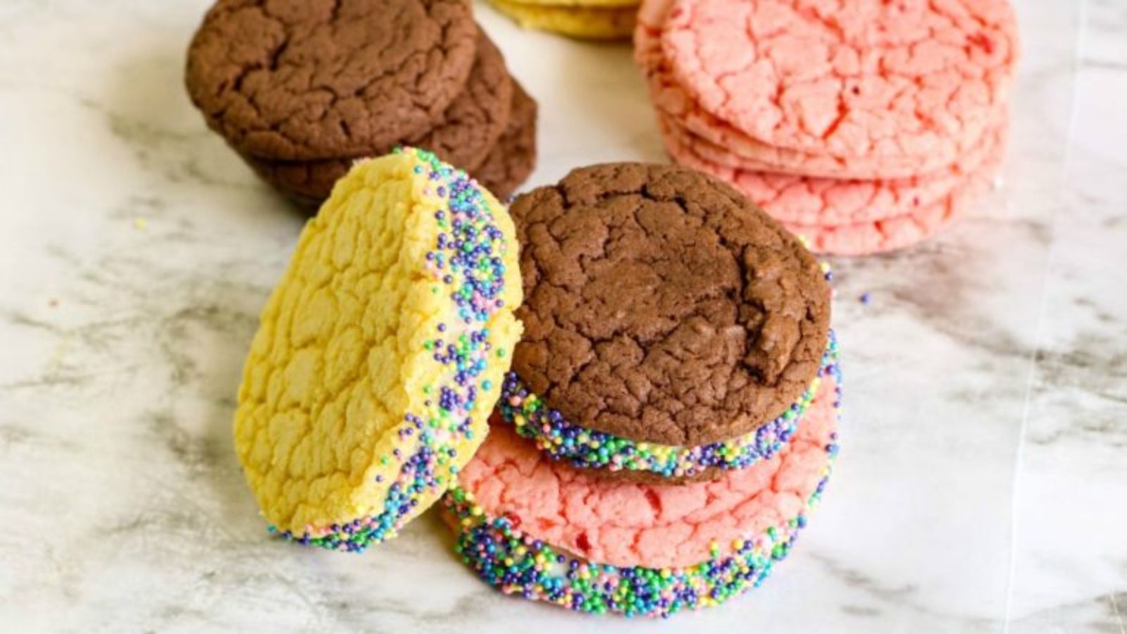 Cake mix cookies on a marble surface.