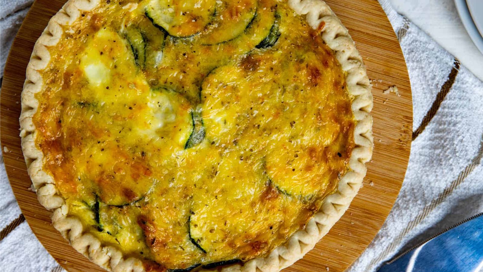 Zucchini pie on a wooden board.