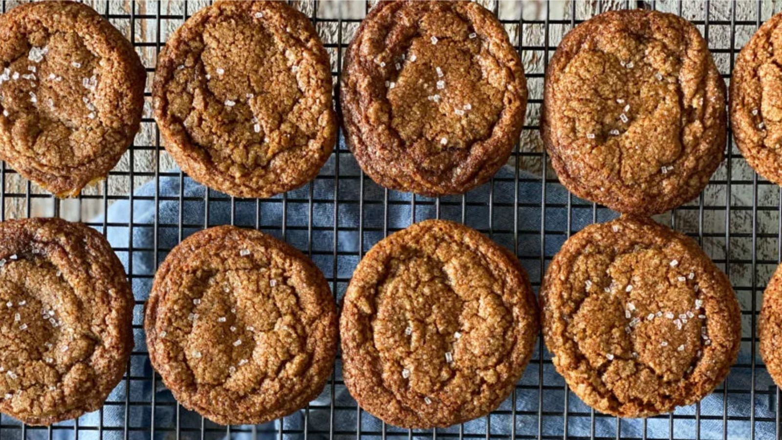 Molasses crinkle cookies on a draining rack.