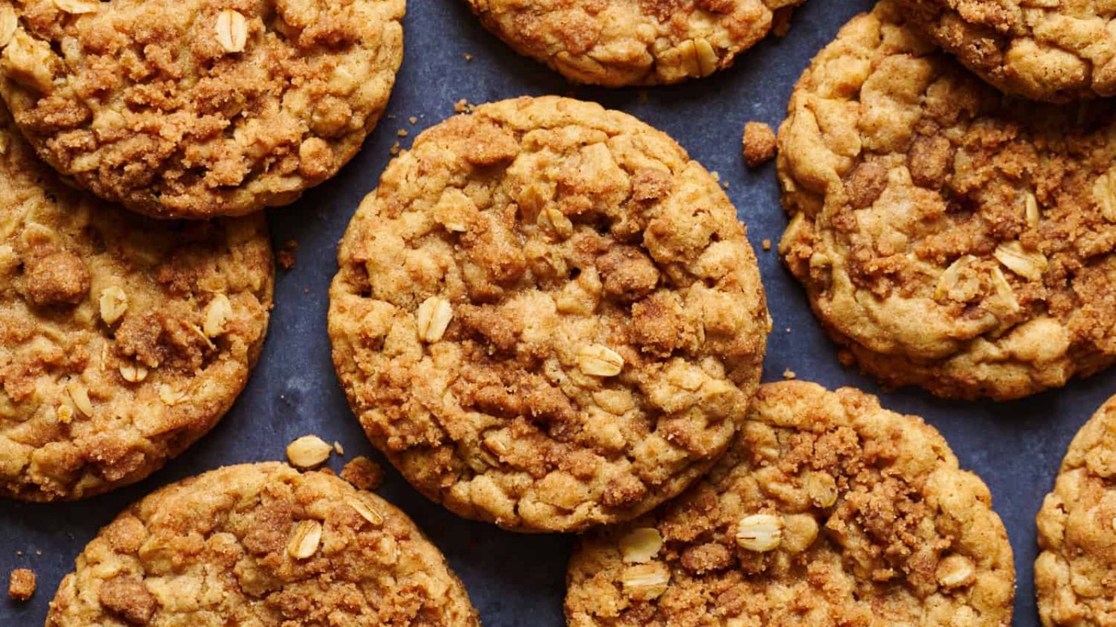 Oatmeal cookies on a black surface.