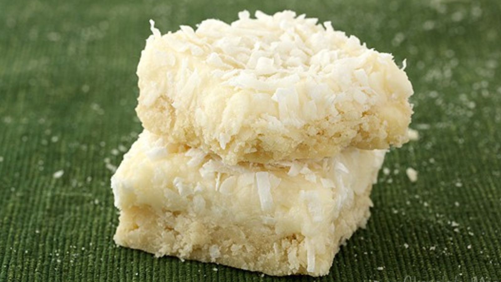 Stack of coconut cookie bars.
