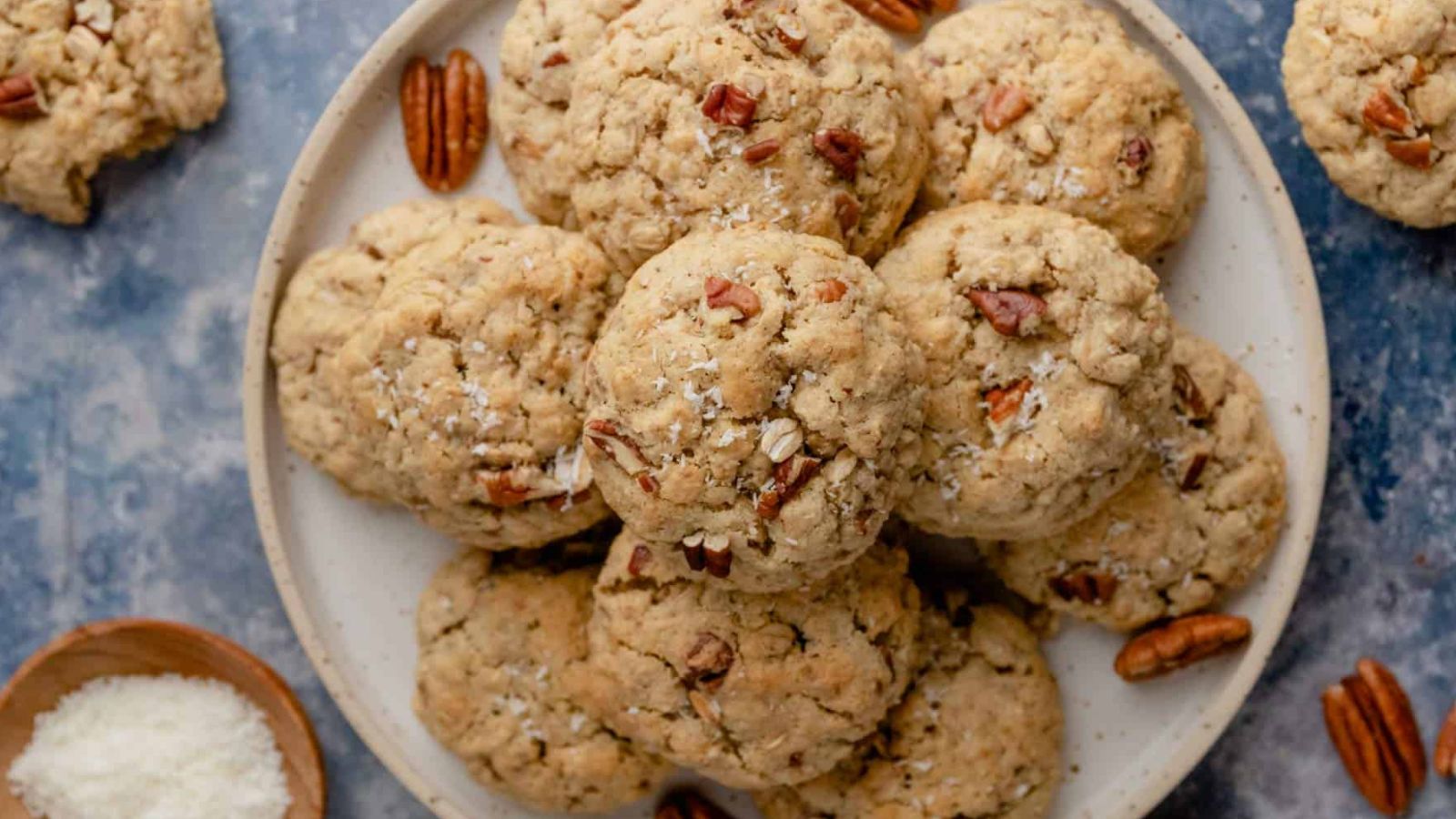 Cookies with pecans on a plate.